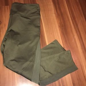Forest green athletic pants with breathable sides